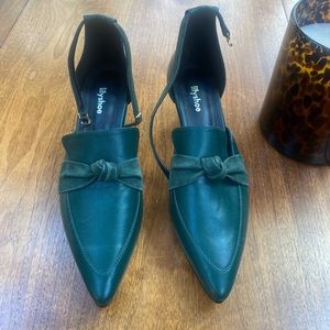 Unworn green leather kitten heels.